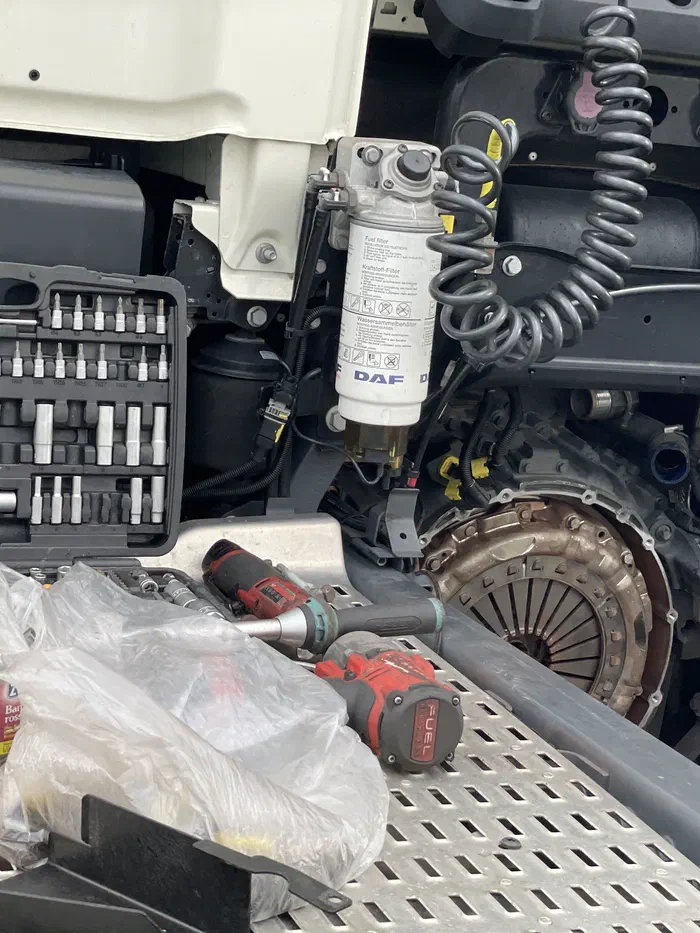 Clutch and tools behind the truck cab